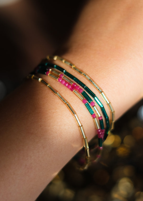 feestelijke armband in goud, petroleum en fuchsia 