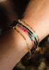 feestelijke armband in goud, petroleum en fuchsia 