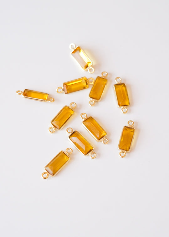 Link baguette citrine, verguld