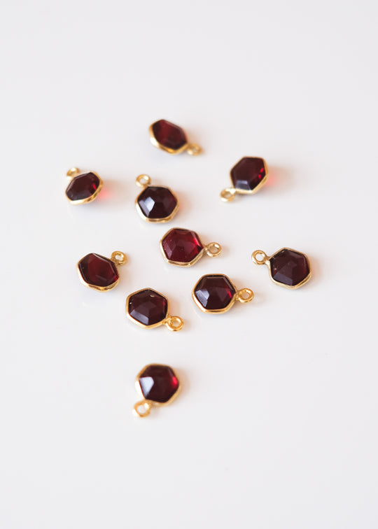 Bedel hexagon granaat, verguld