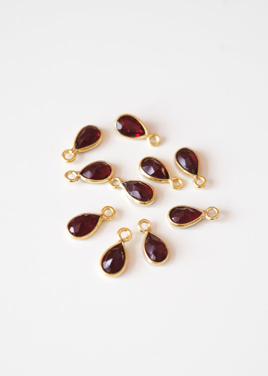 Bedel druppeltje granaat, verguld