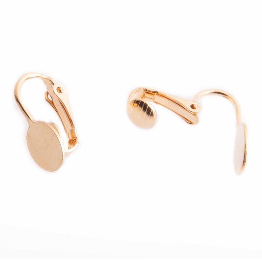 Oorclips met kleefplaatje verguld.