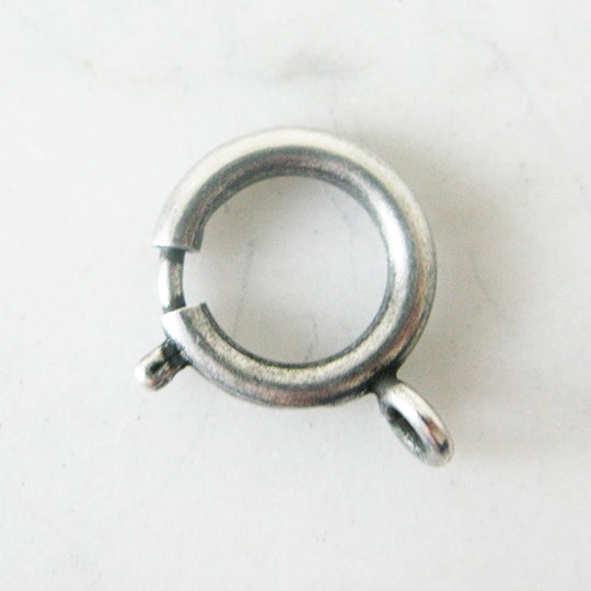 Menotsluiting rond, oud-zilver