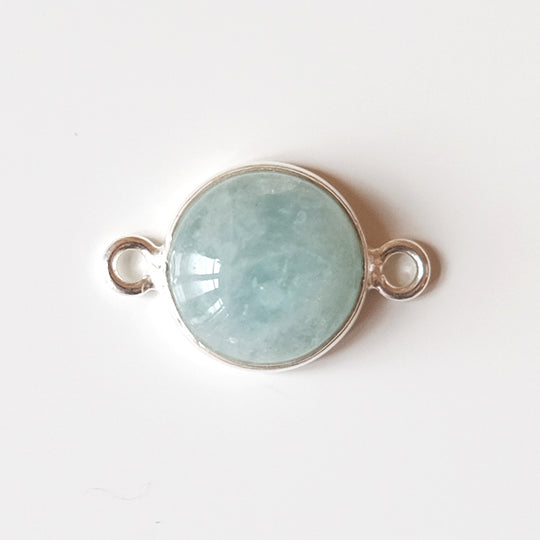 Link cabochon aquamarijn, verguld
