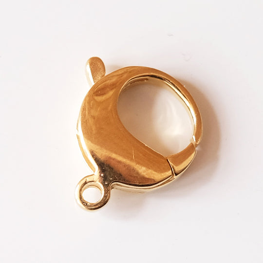 Menotsluiting rond, verguld zilver