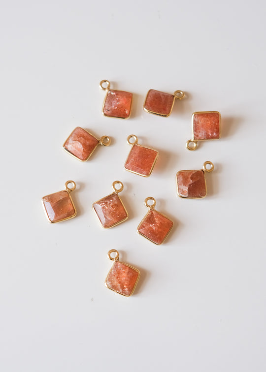 Bedel ruitje zonnesteen, verguld